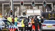 Emergency services stand at the 24 Oktoberplein in Utrecht, on March 18, 2019 where a shooting took place. Netherlands OUT / AFP / ANP / Robin van Lonkhuijsen