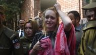 Czech model Tereza Hluskova weeps after the court decision to sentence her to eight years and eight months in prison for attempted heroin smuggling, in Lahore on March 20, 2019.  AFP / ARIF ALI