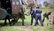 South Africa National Defence Forces personnel deliver relief aid in Buzi, central Mozambique, on March 20, 2019, after the passage of cyclone Idai. AFP / Adrien Barbier
 