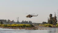 An Iraqi rescue helicopter searches for survivors at the site where an overloaded ferry sank in the Tigris river near Mosul in Iraq, March, 21,2019. Reuters/Stringer 