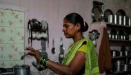Chhaya Kharade, 36, an unemployed farm labourer makes tea inside her house in Chincholi, India, March 12, 2019. Reuters/Danish Siddiqui