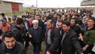 Iranian President Hassan Rouhani (C) during visit to areas affected by floods in the country's northeastern Golestan region. AFP / Iranian Presidency 