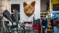 In this picture taken on December 6, 2018, local artist Kacey Wong poses at his studio in Hong Kong.  AFP/Anthony Wallace
