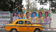 A taxi drives past a poster of Mamata Banerjee, Chief Minister of West Bengal state, in Kolkata, India, February 9, 2019.  Reuters/Rupak De Chowdhuri  