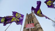UK Independence Party flags flown by pro-Brexit supporters are seen outside the Houses of Parliament in central London on March 29, 2019 after MPs voted down the government's Brexit deal for a third time. AFP / Tolga AKMEN