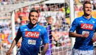 Napoli's Italian midfielder Simone Verdi (L) celebrates with Napoli's Polish forward Arkadiusz Milik after scoring during the Italian Serie A football match AS Roma vs SSC Napoli on March 31, 2019 at the Olympic stadium in Rome. / AFP / Andreas SOLARO