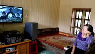 Nguyen Thi Vy, stepmother of Vietnamese national Doan Thi Huong, watches the news from Malaysia of the verdict on a televsion at her house in Nam Dinh province south of Hanoi on April 1,2019.  / AFP or licensors / Nhac NGUYEN 