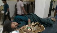 An injured woman rests at a National Medical college and hospital in Birgunj, 136 kilometers (85 miles) south of Kathmandu on March 31, 2019. / AFP / KRANTI SHAH 