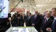 Russian President Vladimir Putin (2ndR), Mercedes-Benz Cars' Member of the Divisional Board Marcus Schaefer (R), German Economy Minister Peter Altmaier (3rd R) and Daimler CEO Dieter Zetsche (4th R) watch a video as they visit Mercedes Benz's new factory 