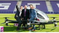 (L-R) Michael Stix, CEO of ProsiebenSat1Puls4, Austrian transport minister Norbert Hofer, Derrick Xiong, co-founder & CMO EHang and Robert Machtlinger, CEO FACC, take a selfie as they pose next to an Air Taxi EHANG 216 during a press preview of FACC AG on