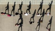 An aerial view shows young people dancing on the Moskva river embankment during a sunny day in central Moscow on April 7, 2019. AFP / Kirill Kudryavtsev  