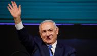 Israeli Prime Minister Benjamin Netanyahu gestures as he appears before supporters at his Likud Party headquarters in the Israeli coastal city of Tel Aviv on election night early on April 10, 2019. AFP / Thomas Coex 