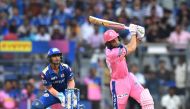 Rajasthan Royals batsman Jos Buttler (R) plays a shot during the 2019 Indian Premier League (IPL) Twenty20 cricket match between Mumbai Indians and Rajasthan Royals at the Wankhede Stadium in Mumbai on April 13, 2019. (AFP / PUNIT PARANJPE)