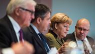 From L:  Walter Steinmeier, Sigmar Gabriel, Angela Merkel and German Chief of Staff Peter Altmaier attend the weekly meeting of the German cabinet at the chancellery in Berlin on November 30, 2016. AFP/John Macdou