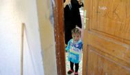 FILE PHOTO: A Libyan displaced child, who fled her house because of the fighting between the Eastern forces commanded by Khalifa Haftar and the internationally recognised government, is seen at Bader School, which is used as a shelter, in Tripoli, Libya A