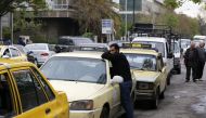 Drivers queue for gasoline in front of a petrol station in the Syrian capital Damascus on April 16, 2019.  AFP / LOUAI BESHARA