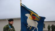 Members of the Swedish Army’s Gotland Regiment hold the unit’s flag on a parade ground near the town of Visby on February 5, 2019, ahead of a commemoration of the unit’s founding.AFP / Tom Little