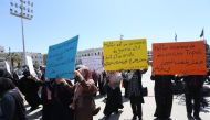 Women carry banners during a funeral ceremony for those, who died in rocket attacks by East Libya-based forces led by commander Khalifa Haftar at the Abu Salim neighborhood, at Martyrs' Square in Tripoli, Libya on April 17, 2019. (Hazem Turkia/Anadolu Age