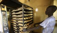 A Sudanese man works at a bakery in the capital Khartoum on January 5, 2018. AFP/Ashraf Shazly