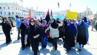 Libyan women shout slogans during a demonstration to demand an end to the Khalifa Haftar's offensive against Tripoli, at Martyrs' Square in Tripoli, Libya April 17, 2019. The sign reads, 