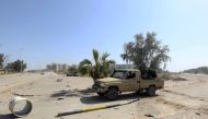 Forces loyal to Libya's Government of National Accord (GNA) gesture on April 18, 2019, after taking control of the area of al-Aziziyah, located some 40 kilometres south of the Libyan capital Tripoli, following fierce clashes with forces loyal to strongman