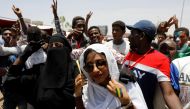 Alaa Salah, a Sudanese protester whose video gone viral and make her an icon for the mass anti-government protests, is surrounded by protesters as she tours in front of the Defence Ministry in Khartoum, Sudan, April 20, 2019. REUTERS/Umit Bektas