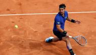 Italy's Fabio Fognini hits a return to Spain's Rafael Nadal during the semi final tennis match of the Monte-Carlo ATP Masters Series tournament in Monaco on April 20, 2019. / AFP / VALERY HACHE
