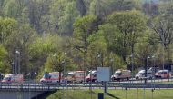 Ambulance vehicles are pictured nearby the military part of Cologne Bonn Airport western Germany, on April 20, 2019. AFP / Caroline Seidel