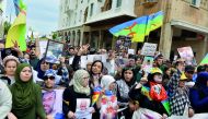Moroccans shout slogans while waving the Berber, or Amazigh, flag during a demonstration against the court of appeal rulings on Al-Hirak al-Shaabi or 