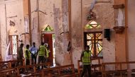 Police officers work at the scene at St. Sebastian Catholic Church, after bomb blasts ripped through churches and luxury hotels on Easter, in Negambo, Sri Lanka April 22, 2019. REUTERS/Athit Perawongmetha