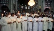 Christian and Muslim clerics light candles for the victims of Sri Lanka's serial bomb blasts, at the Sacred Heart Cathedral in Lahore, Pakistan April 22, 2019. Reuters/Mohsin Raza