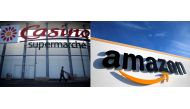 File photos of logo of French retailer Casino is pictured outside a Casino supermarket in Nantes, France, July 20, 2017. REUTERS/Stephane Mahe and the logo of Amazon is seen at the company logistics centre in Boves, France, Jan. 19, 2019. REUTERS/Pascal R
