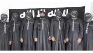 An image grab taken from a press release issued on April 23, 2019 by the Islamist State (IS) group's propaganda agency Amaq, allegedly shows eight men it said carried out a string of deadly suicide bomb blasts on Easter Sunday in Sri Lanka, lined up at an