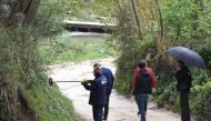 Forensic team search for evidence near the village of Rinas near Tirana on April 10, 2019 at the place where police clashed with robbers who stole millions of euros from Austria Airlines plane. AFP/Gent Shkullaku