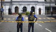 Security personnel stand guard near St. Anthony's Shrine in Colombo on April 24, 2019, three days after a series of bomb blasts targeting churches and luxury hotels in Sri Lanka. AFP / Jewel SAMAD
 