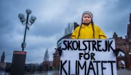 15-year-old Greta Thunberg holds a placard reading 'School strike for the climate' outside the Swedish parliament in Stockholm, Nov 30, 2018. TT News Agency/Hanna Franzen/Reuters