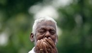 A man mourns at the funeral of Dhami Brindya, 13, victim of a string of suicide bomb attacks on churches and luxury hotels on Easter Sunday, in Negombo, Sri Lanka April 25, 2019. Reuters/Athit Perawongmetha
 