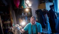 Roman Bajzik (48) works on a wax figurine of Empress Elisabeth of Austria, better known as Sissi in his flat in Bratislava, Slovakia on April 10, 2019.  AFP / Vladimir Simicek 