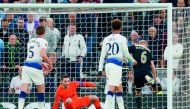 Ajax's Dutch midfielder Donny Van de Beek (R) shoots past Tottenham Hotspur's French goalkeeper Hugo Lloris (2L) to score the opening goal during the UEFA Champions League semi-final first leg football match between Tottenham Hotspur and Ajax at the Totte