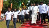 Sri Lanka's President Maithripala Sirisena (C) and Prime Minister Ranil Wickremesinghe (L) arrive for a commemoration ceremony to mark the 26th anniversary of the assassination of Sri Lanka's then-president Ranasinghe Premadasa in Colombo on May 1, 2019. 