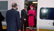  In this file photograph taken on May 6, 1994, French President François Mitterrand (R) welcomes Britain's Queen Elizabeth II (C) as she disembarks from the inaugural Eurostar train during the inauguration of the Channel Tunnel at Coquelles in northern Fr