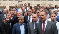 Employees of the Lebanese central bank gather during a strike over state budget proposals that would cut their benefits, in front of the central bank in Beirut, Lebanon May 6, 2019. REUTERS/Mohamed Azakir