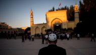 A Muslim man arriving at the Id Kah Mosque for the morning prayer on Eid al-Fitr in the old town of Kashgar inXinjiang, Uighur Autonomous Region, China on June 26, 2017.  AFP / Johannes Eisele
