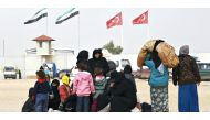 Internally displaced Syrians wait near the Bab al-Salam crossing, opposite the Turkey's Kilis province, on the outskirts of the northern Syrian border town of Azaz in this Reuters file photo