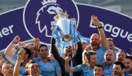 Manchester City manager Pep Guardiola lifts the trophy as they celebrate winning the Premier League REUTERS/Toby Melville 