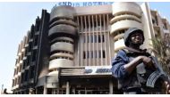 FILE PHOTO: A policeman stands guard in front of Splendid Hotel in Ouagadougou, Burkina Faso, January 17, 2016. Reuters/Joe Penney