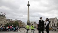 Armed police personnel patrol in London's Trafalgar Square on August 4, 2016. AFP