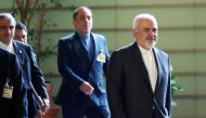 Iranian Foreign Minister Mohammad Javad Zarif, right, walks to meet Japanese Prime Minister Shinzo Abe at Abe's official residence in Tokyo Thursday, May 16, 2019. Eugene Hoshiko/Pool via REUTERS