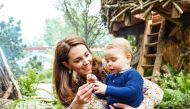 A picture released by Kensington Palace on May 19, 2019 shows Britain's Catherine, Duchess of Cambridge standing with Prince Louis in the Adam White and Andree Davies co-designed 'Back to Nature' garden ahead of the RHS Chelsea Flower Show in London. AFP 