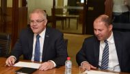 Australian Prime Minister Scott Morrison (L) and Treasurer Josh Frydenberg meet with Reserve Bank Governor Philip Lowe (not pictured) during their meeting at the Reserve Bank in Sydney on May 22, 2019. / AFP / Peter PARKS 